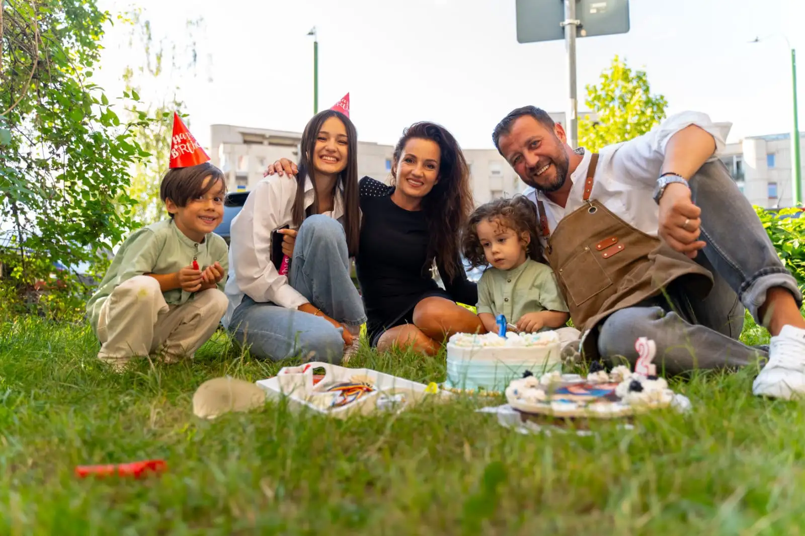 Family celebrating a birthday outdoors
